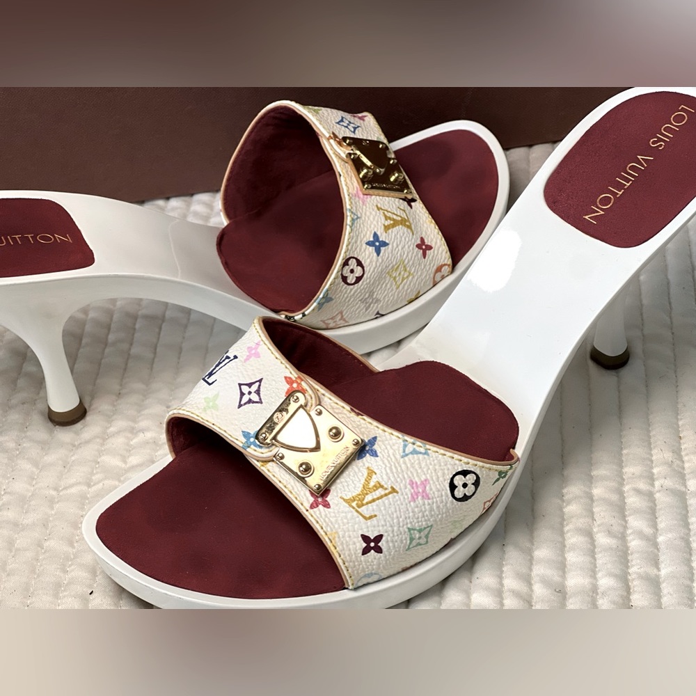Women’s White print Louis Vuitton heels.